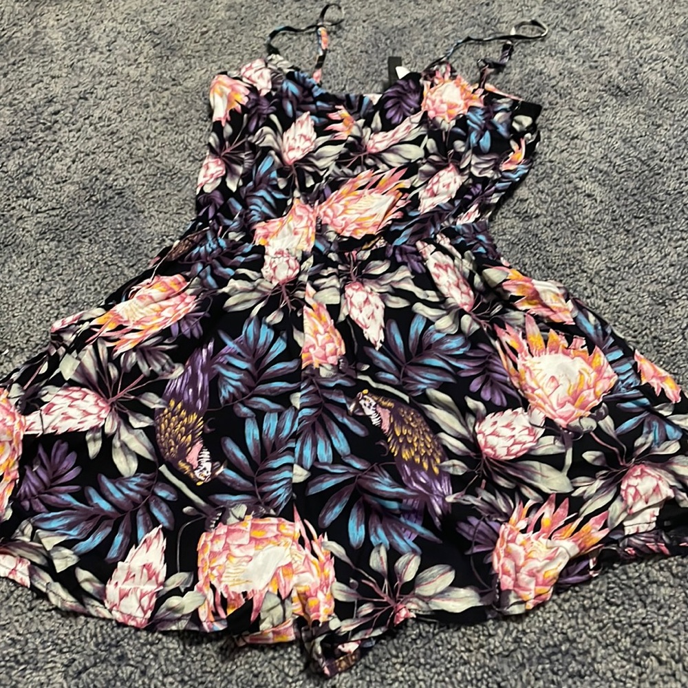 One- piece floral skirt outfit with pockets. Worn once